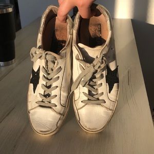 Black and white golden goose sneakers